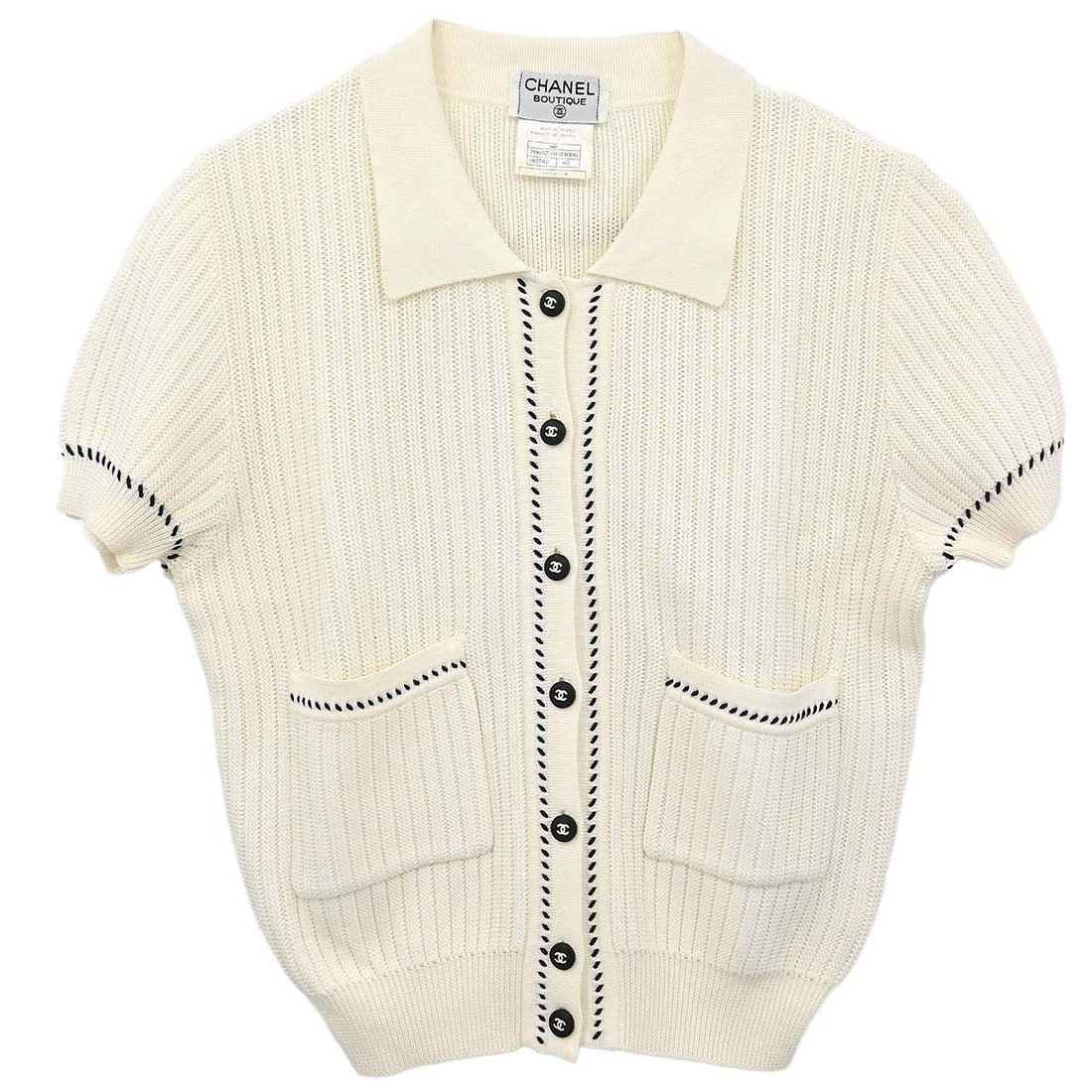 CHANEL 96P White Cotton Knit Short Sleeve Cardigan Size 40: CHANEL 96P White Cotton Knit Short Sleeve Cardigan Size 40 Vintage Chanel short sleeve knit cardigan in white cotton with button accents and two exterior pockets. This women's regular-fit cardigan is 