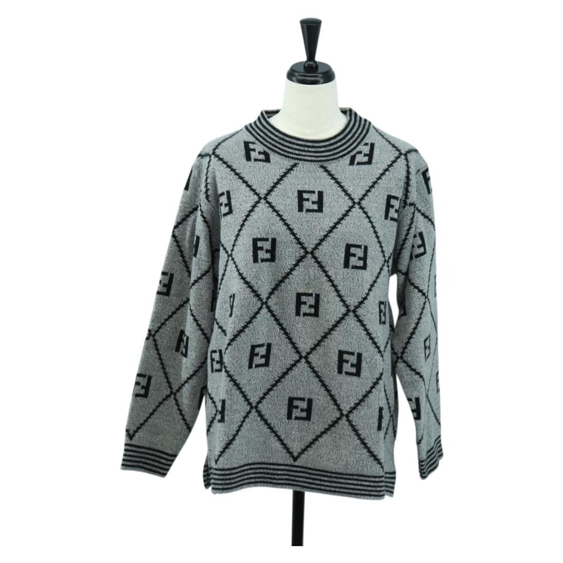 FENDI gray wool Zucca canvas jacket: FENDI gray wool Zucca canvas jacket This FENDI women's jacket is crafted from wool and Zucca canvas in a classic gray hue. Made in Italy, it features a knit sweater design with a shoulder width of app