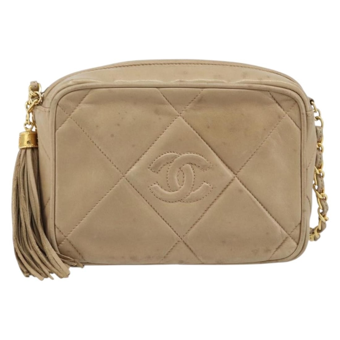 Chanel Vintage Diamond CC Camera Bag Beige Lambskin: Chanel Vintage Diamond CC Camera Bag Beige Lambskin This Chanel Vintage Diamond CC Camera Bag is crafted from quilted beige lambskin leather and features the iconic diamond pattern. Designed for