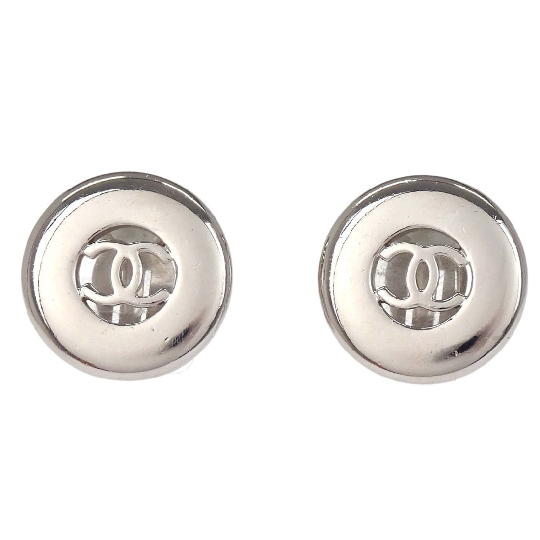 CHANEL 97A Silver Plated Round Clip On Button Earrings: CHANEL 97A Silver Plated Round Clip On Button Earrings Round Chanel button-style clip-on earrings in silver plated metal. Made in France, this pair features a classic button design with clip-on closur