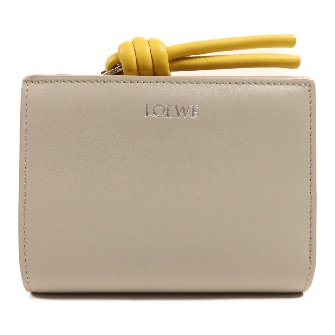 LOEWE bi fold wallet in gray yellow calfskin leather: LOEWE bi fold wallet in gray yellow calfskin leather LOEWE bi-fold wallet in calfskin leather with a gray and yellow colorway. This women's wallet features a compact fold design with multiple interior