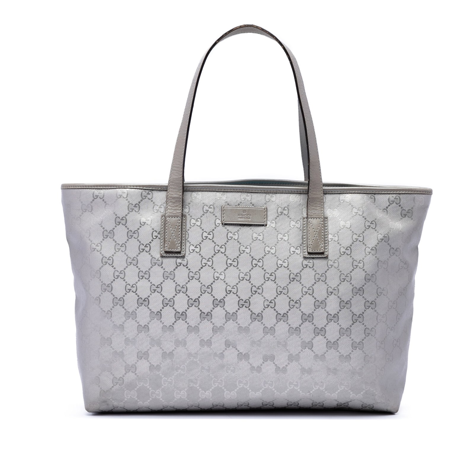 Gucci Medium GG Imprime Silver Tote Bag: Gucci Medium GG Imprime Silver Tote Bag Gucci Medium GG Imprime Tote in silver with a coated canvas body, leather trim, and flat leather straps. The bag features a top zip closure and an interior with