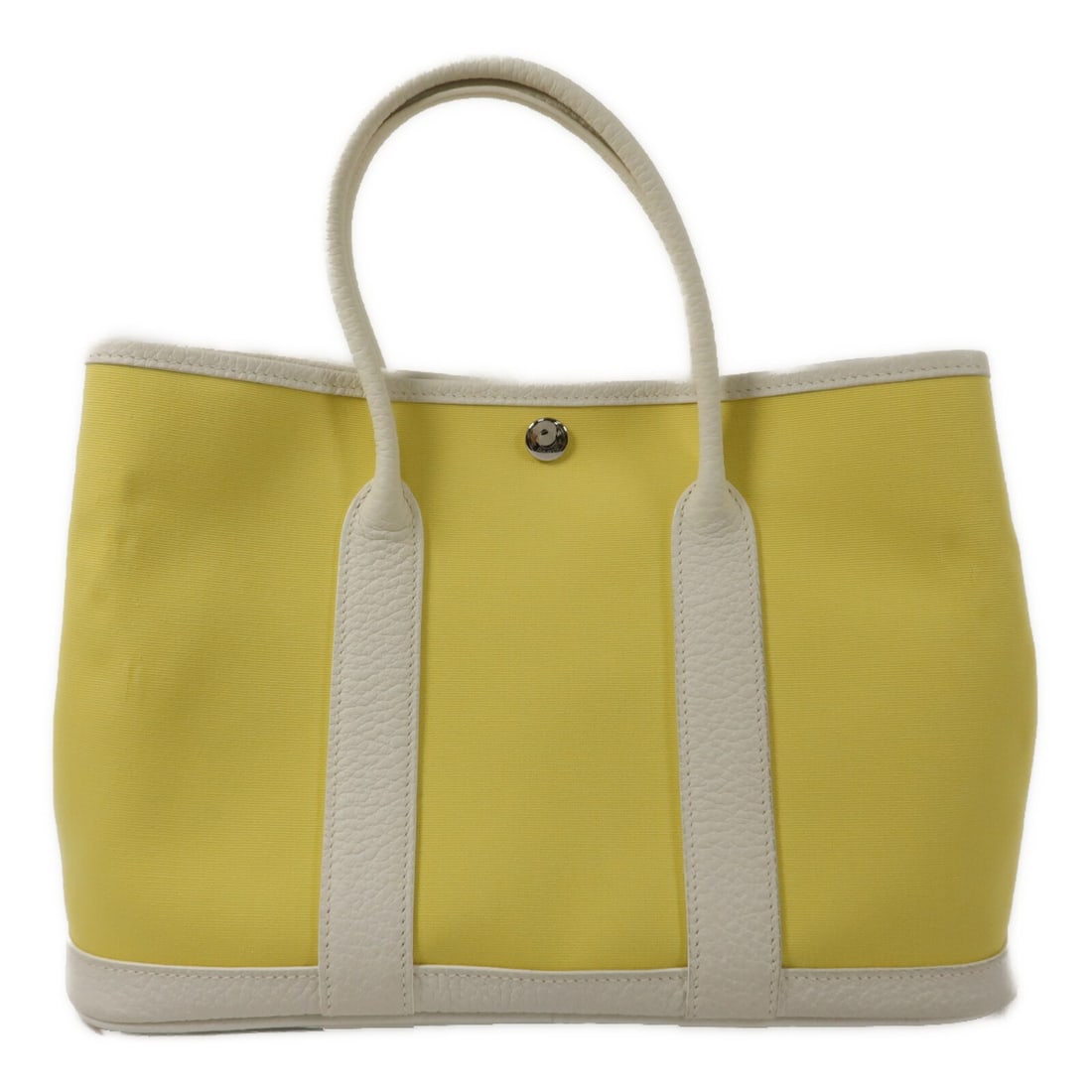 Hermes Garden Party TPM Canvas Tote Bag Jaune Poussin PHW: Hermes Garden Party TPM Canvas Tote Bag Jaune Poussin PHW Hermes Garden Party TPM tote bag in canvas with a yellow and white colorway. This women's tote is made in France and features a hook button cl