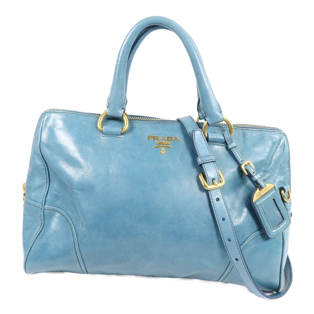 Prada blue calfskin 2 way shoulder bag with strap and padlock: Prada blue calfskin 2 way shoulder bag with strap and padlock Prada 2-way shoulder bag in blue calfskin leather with gold-tone hardware. Made in Italy, this women's bag features an interior with one o