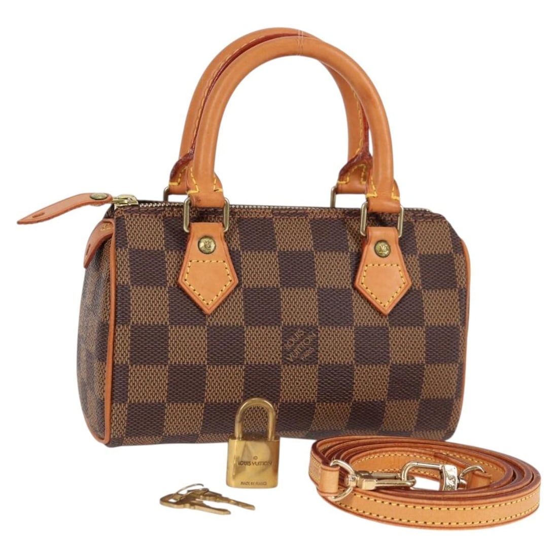 Louis Vuitton N41536 Mini Speedy Hand Bag Damier Ebene Canvas: Louis Vuitton N41536 Mini Speedy Hand Bag Damier Ebene Canvas Louis Vuitton Damier Ebene Mini Speedy handbag in Damier Ebene canvas, made in France. This women's handbag comes with a dust bag, padlock