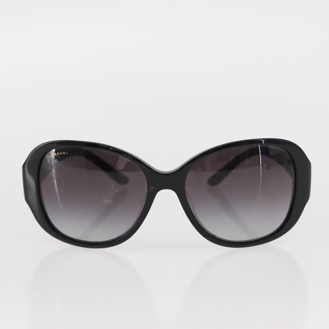 Black Bvlgari Plastic Sunglasses for Women Italy: Black Bvlgari Plastic Sunglasses for Women Italy This pre-owned pair of Bvlgari sunglasses is designed for women and crafted from black plastic. They show signs of use, including surface rubbing, slig