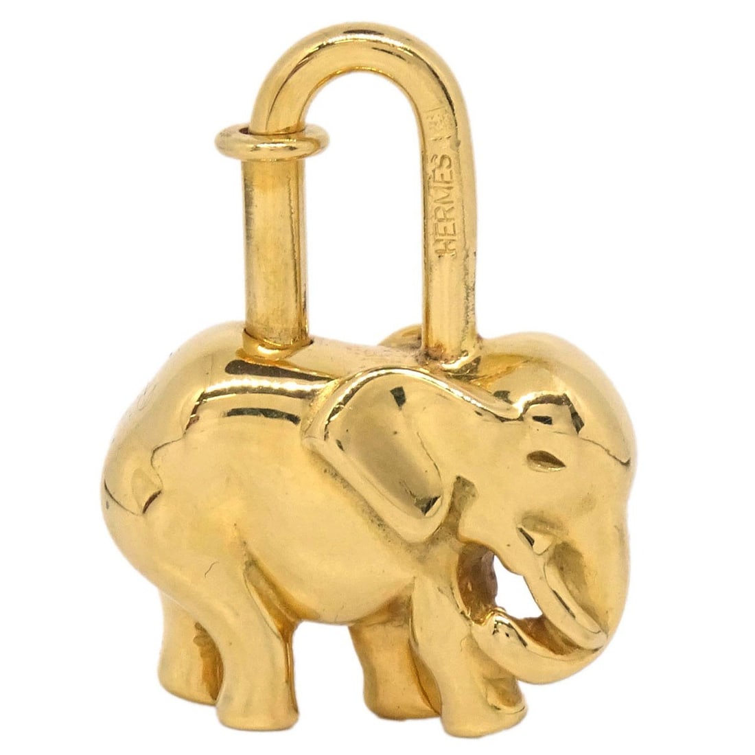 Hermes Elephant Cadena Lock Charm Gold Plated 1988: Hermes Elephant Cadena Lock Charm Gold Plated 1988 Vintage Hermes elephant motif Cadena lock bag charm in gold-plated metal. The piece is described as a charm and comes with a box. Exterior condition 