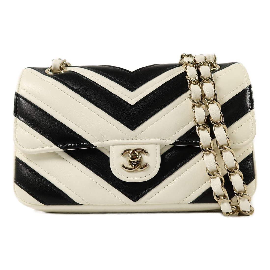 CHANEL Mini Flap Shoulder Bag CC GHW Black White Lambskin: CHANEL Mini Flap Shoulder Bag CC GHW Black White Lambskin Mini flap chain shoulder bag in black and white lambskin leather with a CC turn-lock closure. This women's shoulder bag includes a storage bag