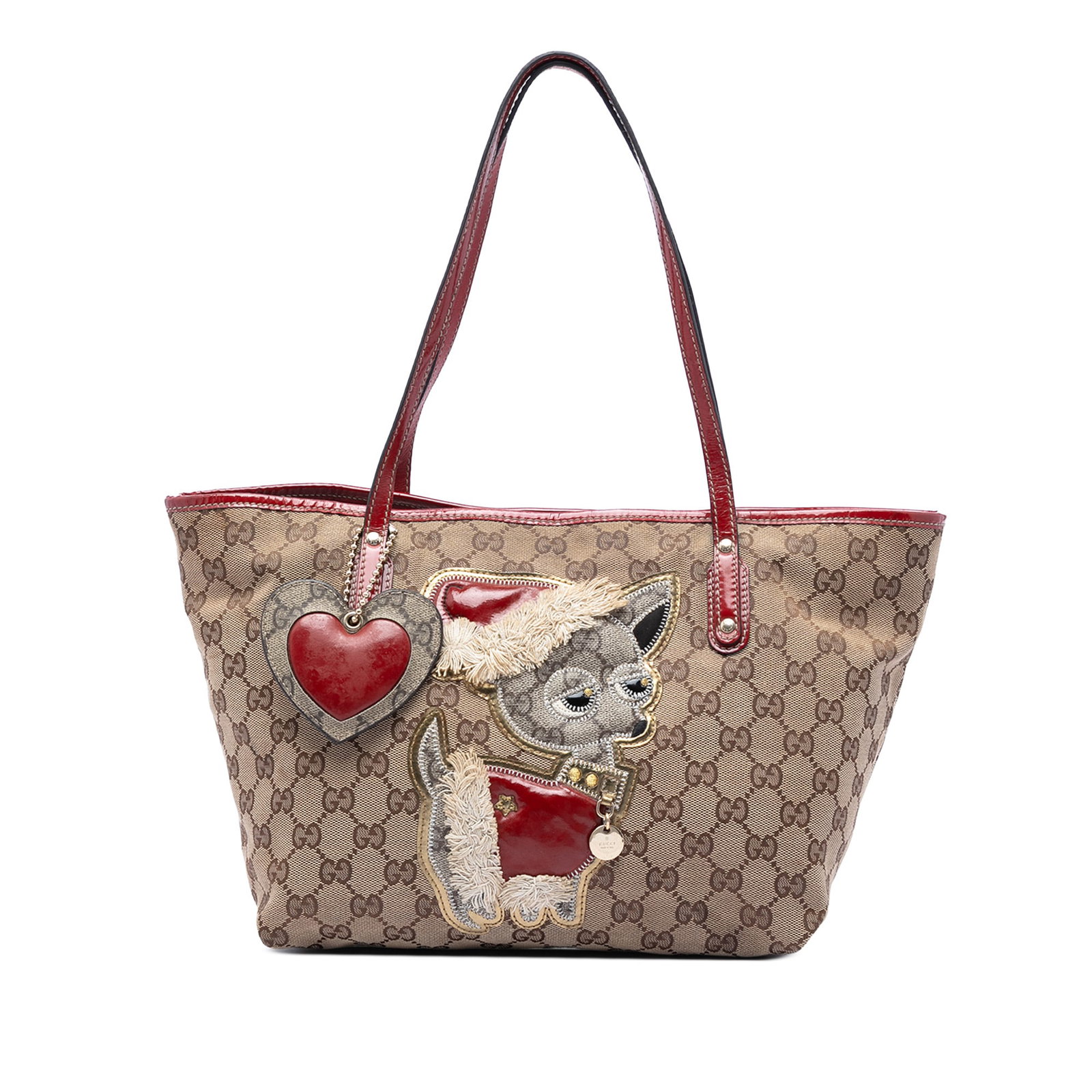 Gucci Small GG Canvas Chihuahua Tote with Leather Trim: Gucci Small GG Canvas Chihuahua Tote with Leather Trim Gucci Small GG Canvas Brando Guccioli Holiday Chihuahua Tote in beige fabric with leather trim and flat leather shoulder straps. The bag features