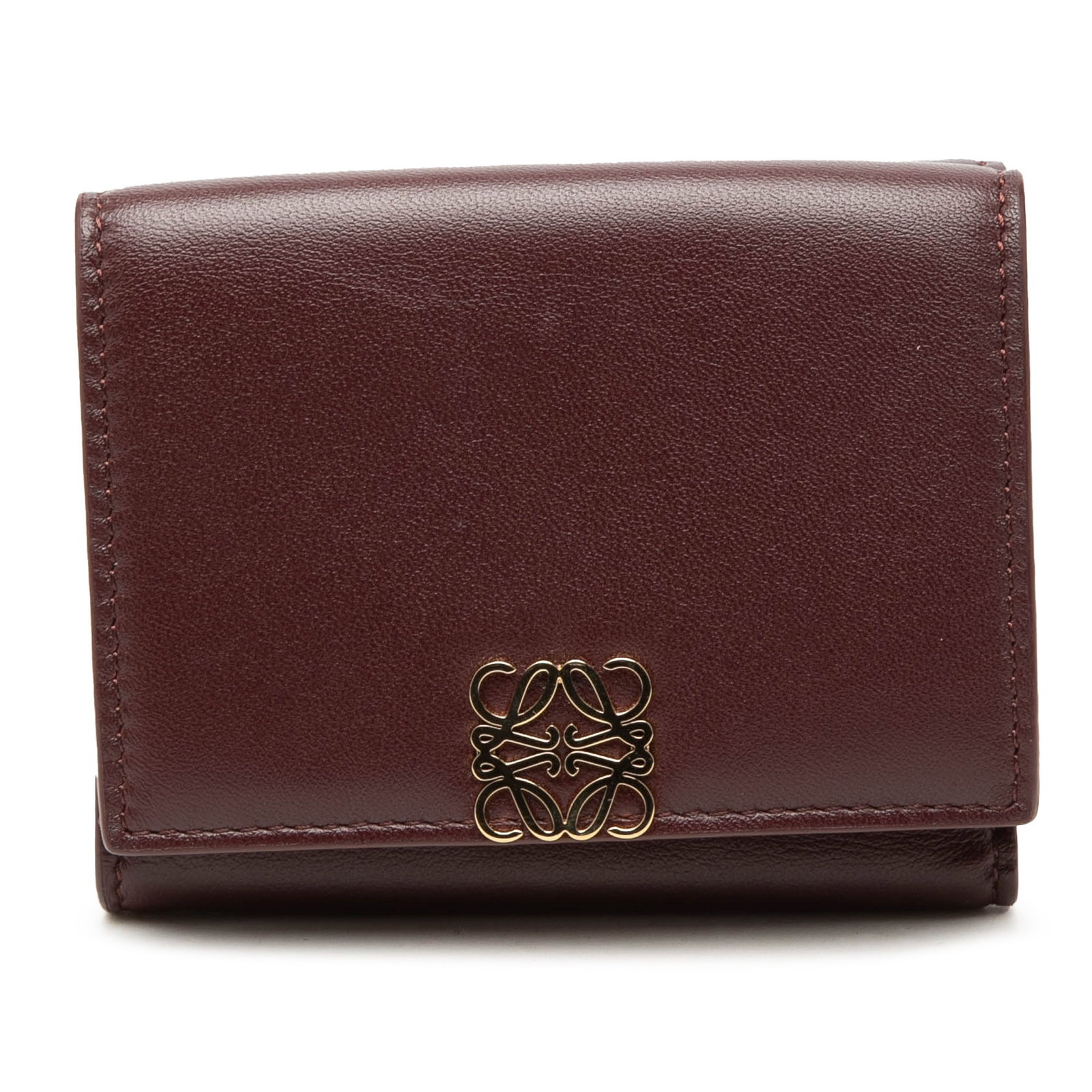 LOEWE Red Leather Trifold Wallet Anagram: LOEWE Red Leather Trifold Wallet Anagram This LOEWE trifold wallet is crafted from leather and features the brand's signature Anagram design. It is designed with a flap and button closure, interior sl