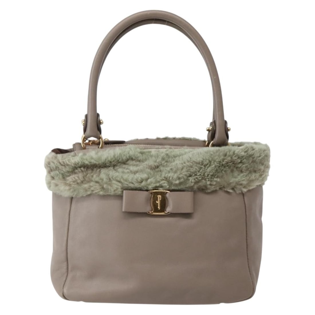 Beige Leather Vala Handbag by Salvatore Ferragamo for Women: Beige Leather Vala Handbag by Salvatore Ferragamo for Women This Salvatore Ferragamo Vala handbag for women features beige leather construction with metal fittings. The exterior shows signs of wear in