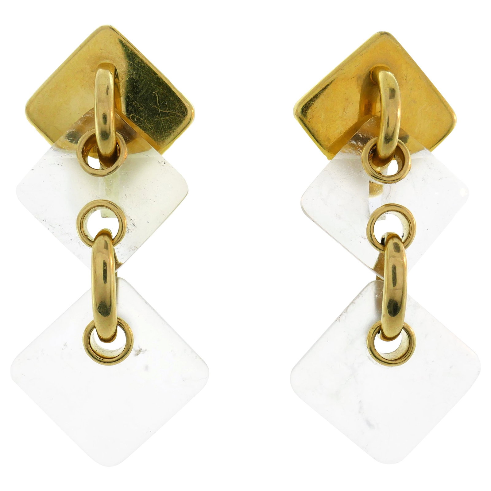 1970s Aldo Cipullo 18k Yellow Gold Rock Crystal Earrings: 1970s Aldo Cipullo 18k Yellow Gold Rock Crystal Earrings Chic geometric earrings created by Aldo Cipullo in the 1970s. Made of 18k yellow gold with rock crystal, they are described as versatile and we