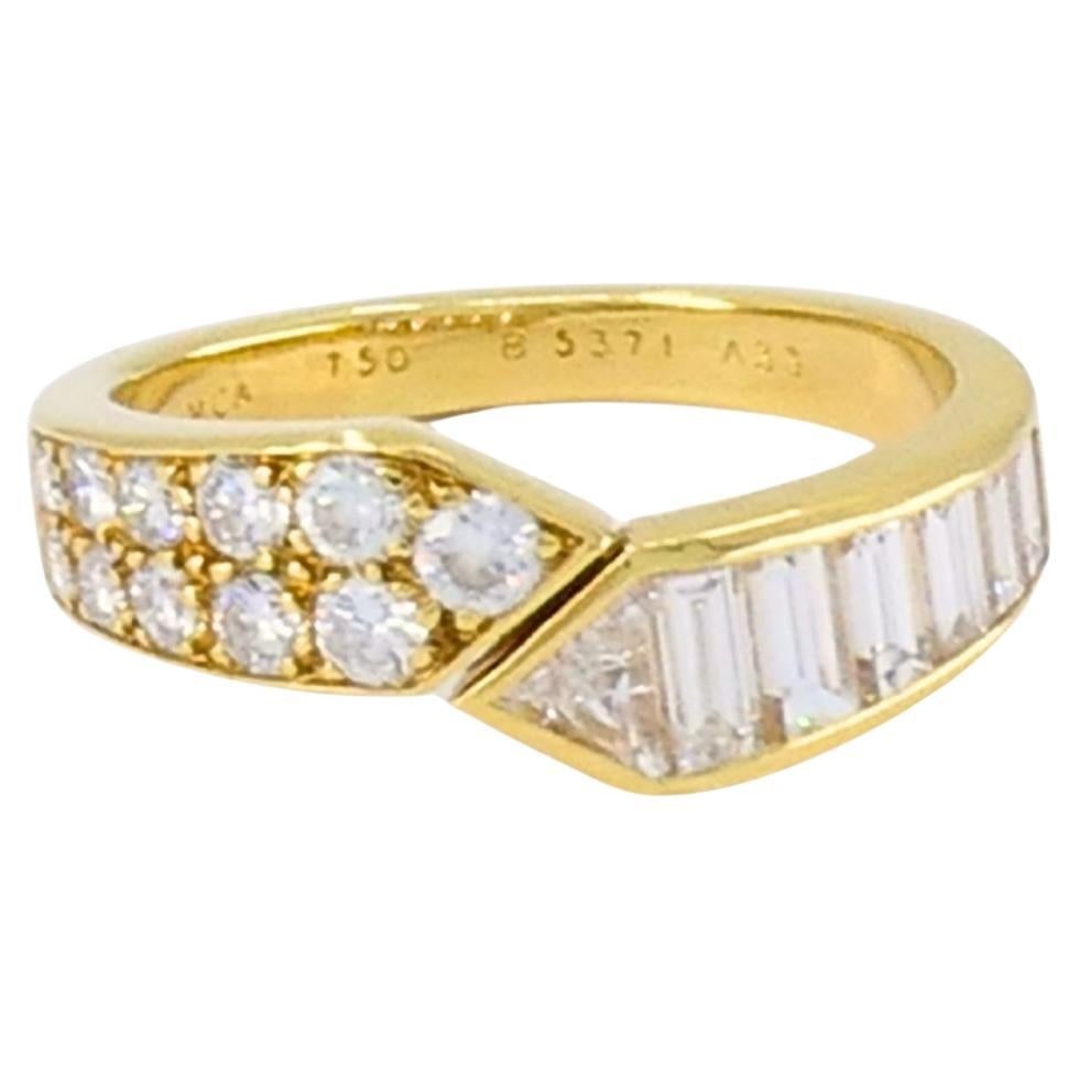 Van Cleef Arpels Diamond Bypass Ring in 18K Gold: Van Cleef Arpels Diamond Bypass Ring in 18K Gold Vintage Van Cleef & Arpels bypass ring in 18k gold with diamonds, featuring an open curve design with two pointed ends. One side is set with round bril