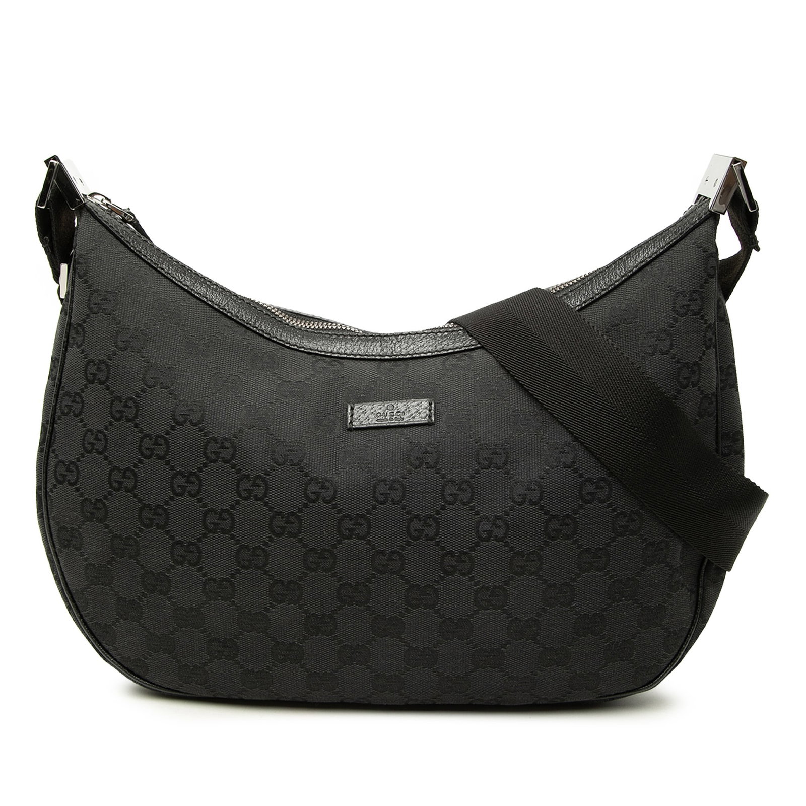 Gucci GG Canvas black crossbody bag with leather trim: Gucci GG Canvas black crossbody bag with leather trim Gucci GG Canvas Crossbody bag with a canvas body, leather trim, an adjustable flat strap, top zip closure, and interior zip and slip pockets. Made