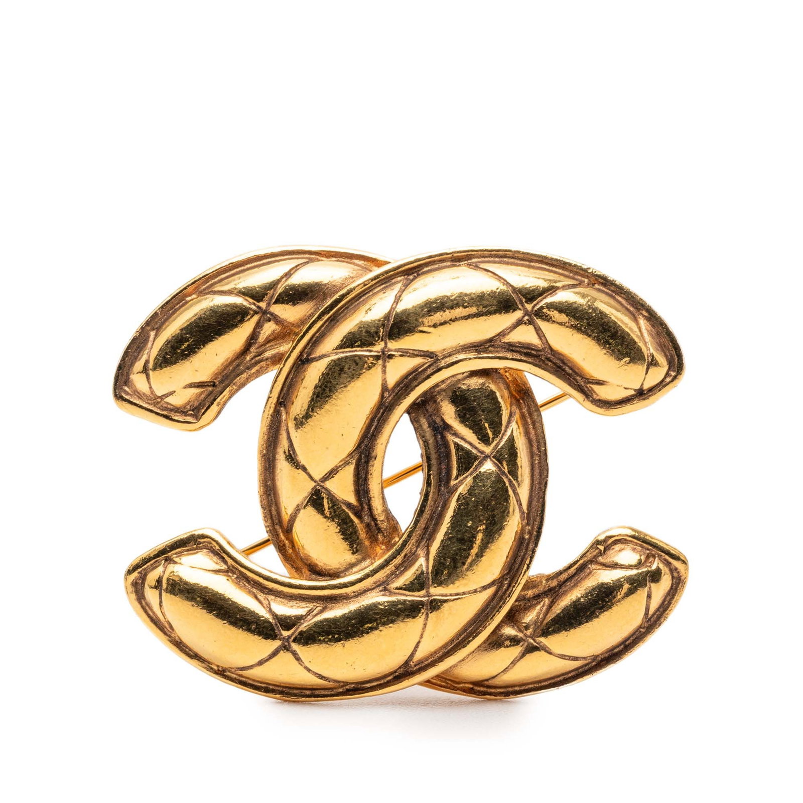 Chanel CC Quilted Gold Tone Brooch: Chanel CC Quilted Gold Tone Brooch This Chanel CC Quilted Gold Plated Brooch features a gold-tone metal construction with a classic quilted design and a back pin closure. Made in France, this brooch i
