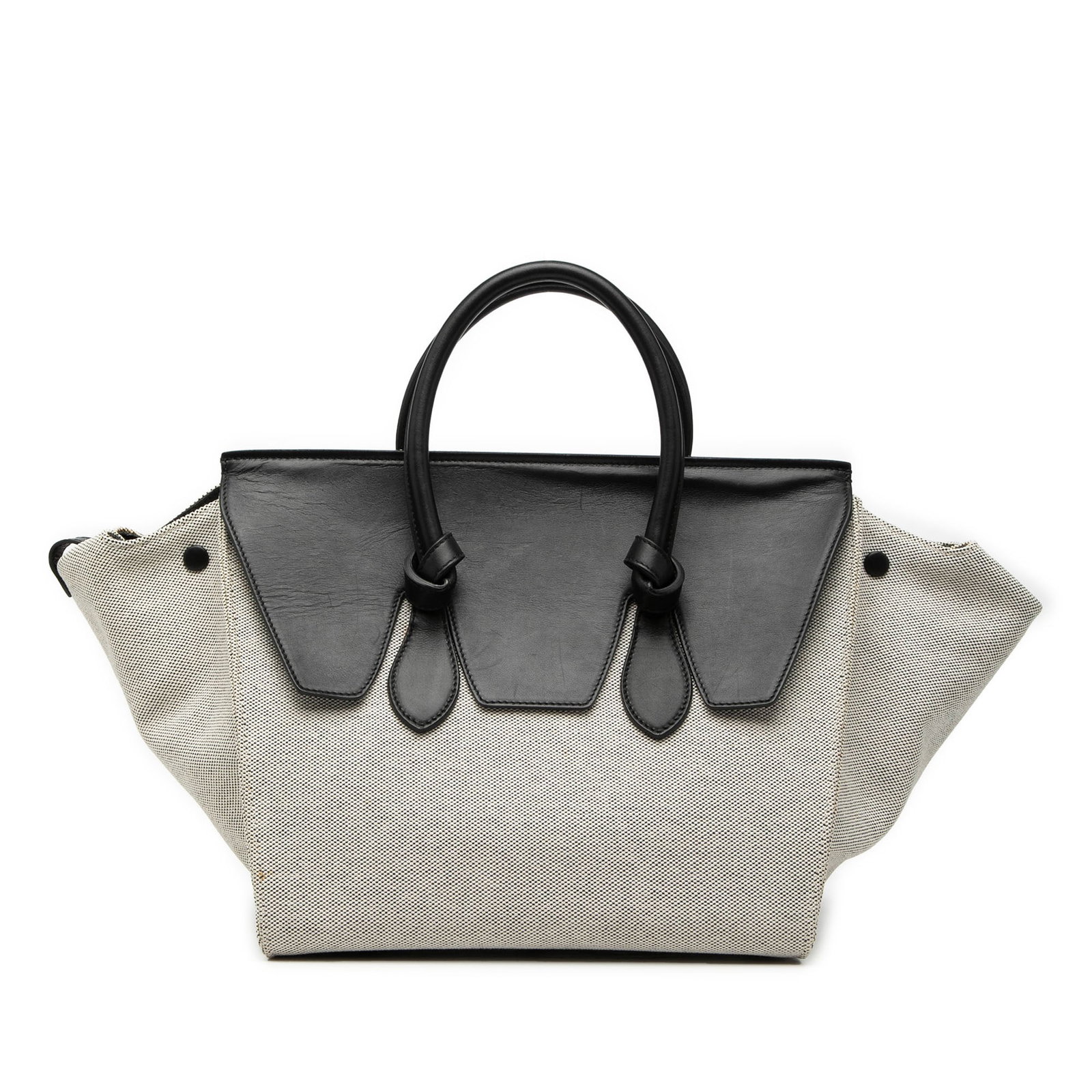 Celine Tie Knot Small Bicolor Canvas Calfskin Handbag: Celine Tie Knot Small Bicolor Canvas Calfskin Handbag This Celine Small Bicolor Tie Knot Handbag features a canvas and calfskin leather construction with rolled leather handles, a top flap, and pull-t