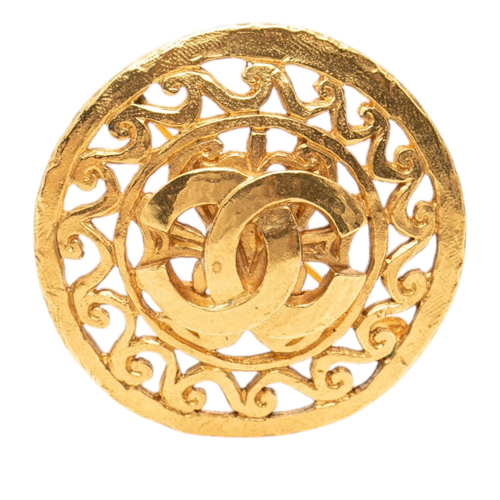 Chanel round medallion brooch in gold tone metal: Chanel round medallion brooch in gold tone metal Round Chanel CC medallion brooch in gold-tone metal with a back pin closure. This costume jewelry piece is made in France. Condition is AB with visible