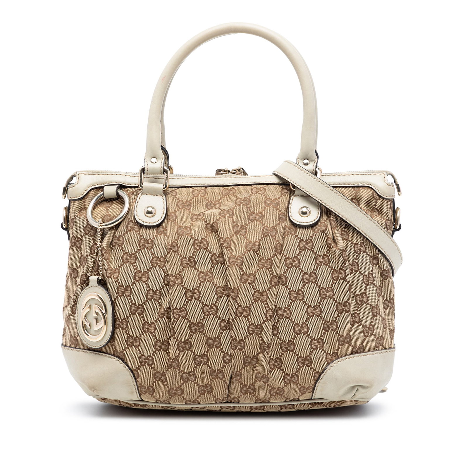 Gucci Sukey GG Canvas Beige Satchel Bag: Gucci Sukey GG Canvas Beige Satchel Bag This Gucci GG Canvas Sukey Satchel features a beige fabric body with leather trim, rolled leather handles, a flat leather strap, and a top zip closure. The inte
