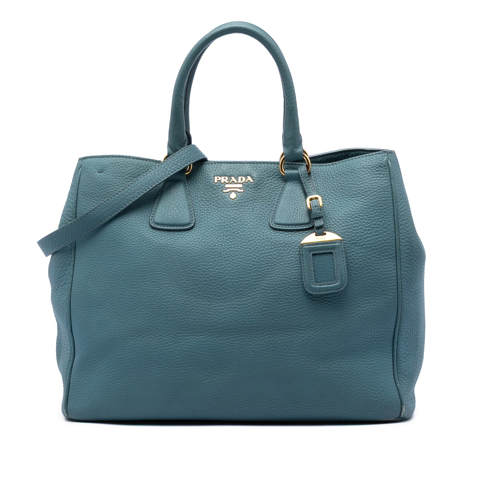 Prada Vitello Daino Leather Satchel Tote Blue: Prada Vitello Daino Leather Satchel Tote Blue Prada Vitello Daino Open Convertible Tote in blue leather, made in Italy. This satchel-style bag features rolled leather handles, a detachable flat leathe