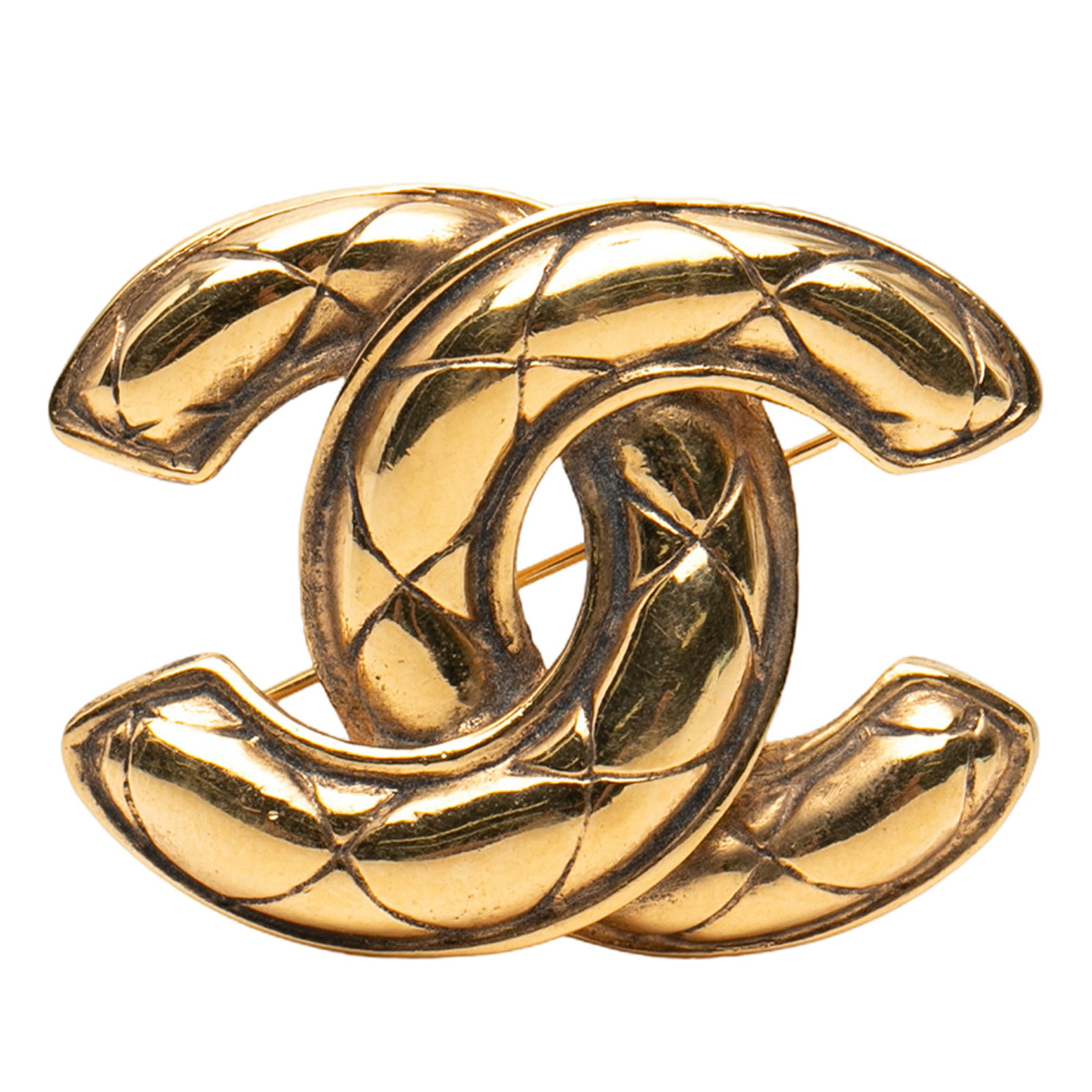 Chanel CC Quilted Gold Tone Metal Brooch Pin: Chanel CC Quilted Gold Tone Metal Brooch Pin This Chanel brooch features a gold-tone metal body with a quilted CC design and a back pin closure. It is categorized as a costume accessory and originates
