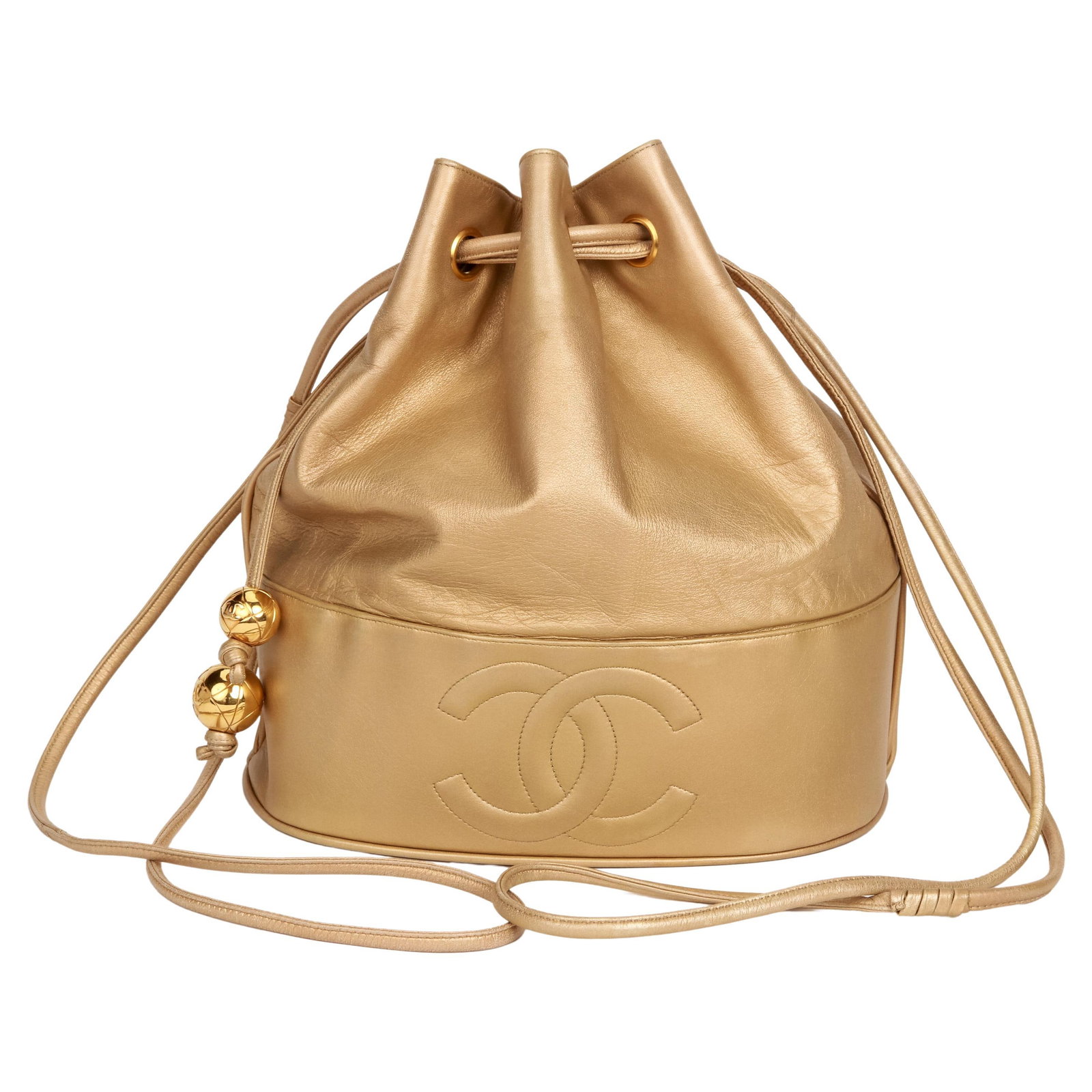 1990s Chanel Gold Lambskin Bucket Bag with Hologram: 1990s Chanel Gold Lambskin Bucket Bag with Hologram This vintage Chanel bucket bag from the 1990s is a rare and collectible piece crafted from luxurious gold lambskin. With dimensions of 11 in (27.94 