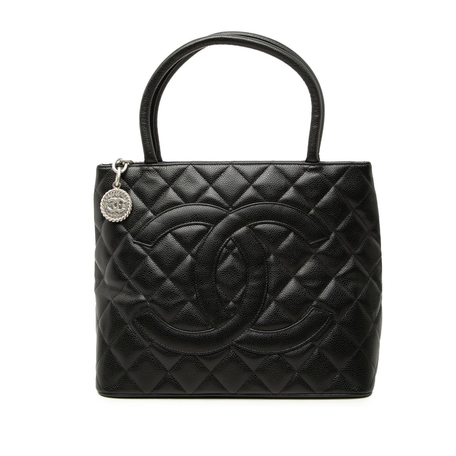 Chanel Medallion Tote Black Caviar Leather Handbag: Chanel Medallion Tote Black Caviar Leather Handbag Quilted caviar leather tote bag with rolled leather handles, a top zip closure, an exterior back slip pocket, and interior zip and slip pockets. Incl