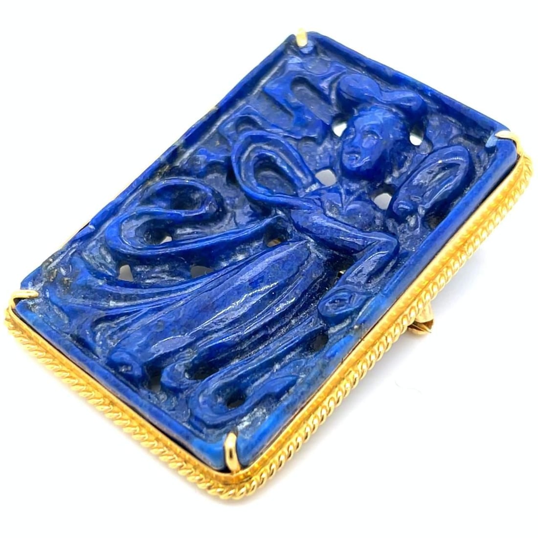 1960's 14K Yellow Gold Lapis Lazuli Carved Brooch: 1960's 14K Yellow Gold Lapis Lazuli Carved Brooch This exquisite 1960's brooch features a stunning carved lapis lazuli set in luxurious 14K yellow gold. Weighing 31.8 grams, this piece is both elegant