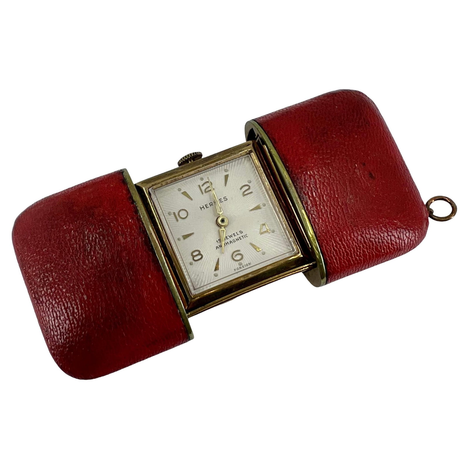 Hermes 1960 Travel Watch in Red Leather Case: Hermes 1960 Travel Watch in Red Leather Case Vintage Hermes travel watch from circa 1960, made in France and presented in a red leather case with a slide opening mechanism. It features a square face w