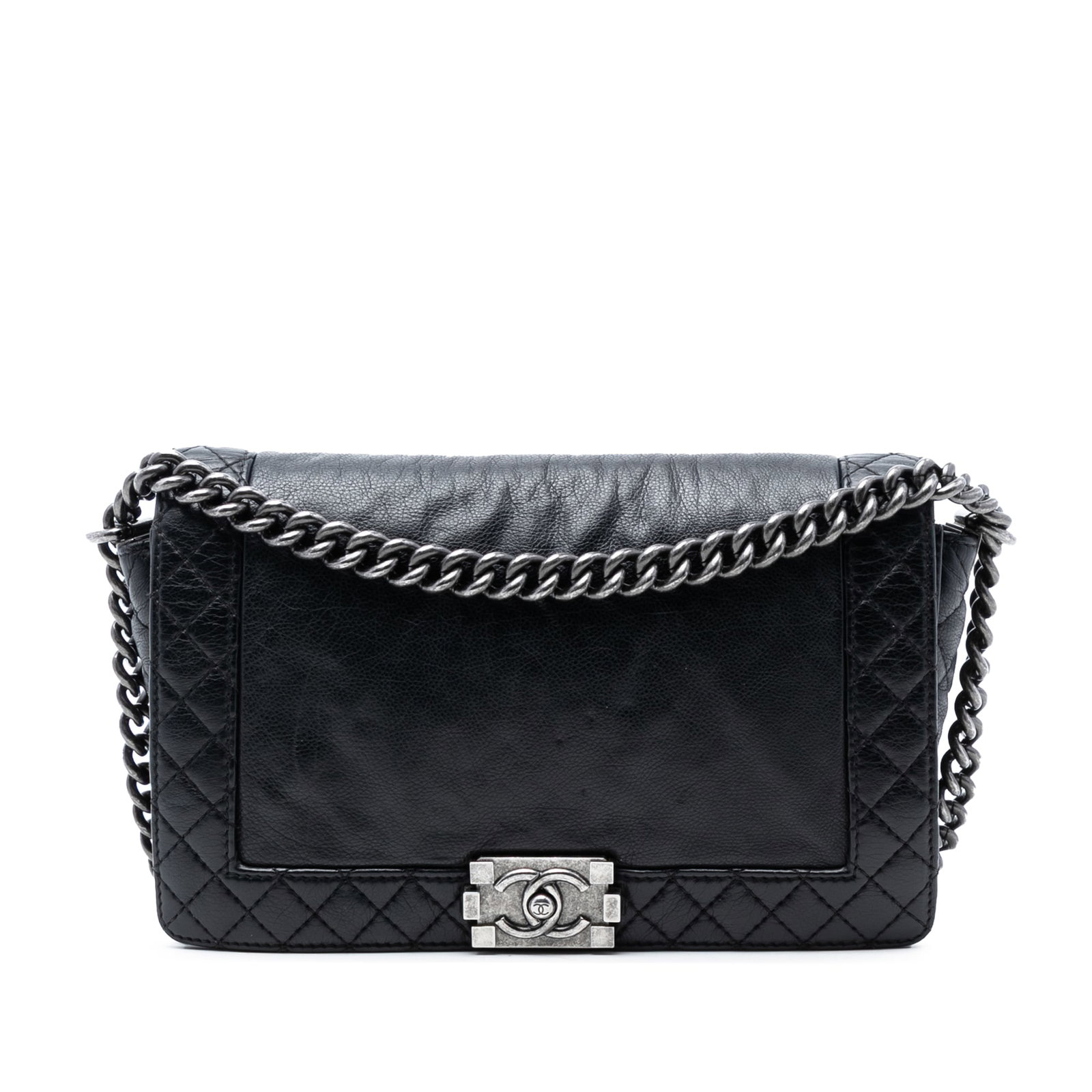 Black Leather Chanel Boy Reverso Medium Flap Bag with Silver Chain Strap: Black Leather Chanel Boy Reverso Medium Flap Bag with Silver Chain Strap This Chanel Medium Calfskin Boy Reverso Flap bag features a black leather body with a silver-tone chain strap, a front flap wit