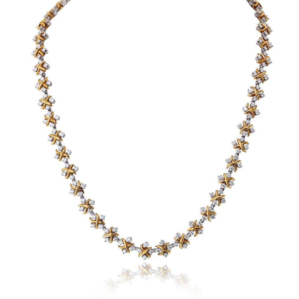Tiffany & Co. Schlumberger necklace in platinum and 18K yellow gold: Tiffany & Co. Schlumberger necklace in platinum and 18K yellow gold Pre-owned Tiffany & Co. Schlumberger necklace crafted in platinum and 18K yellow gold, accented with approximately 11 cts. of diamon