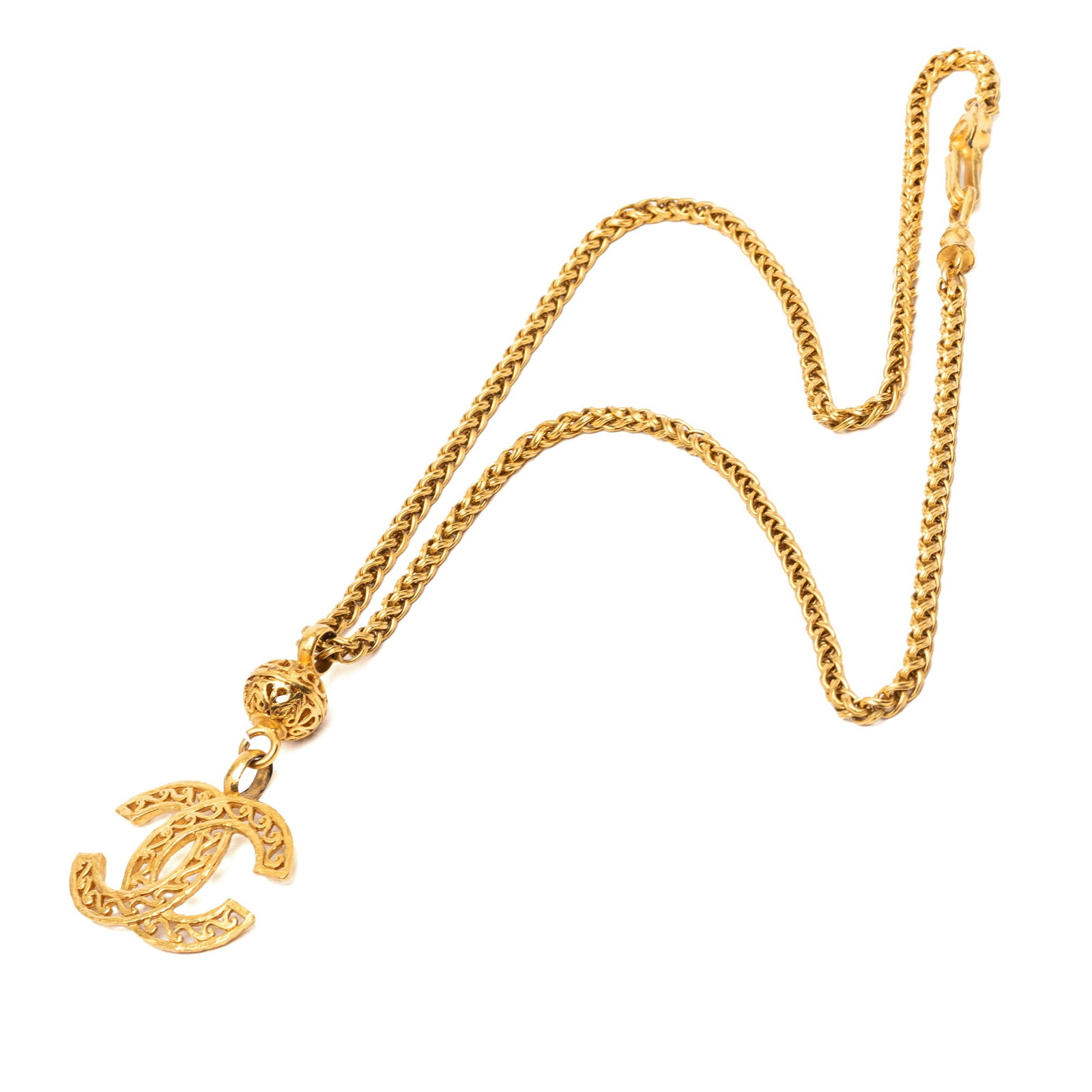 Chanel CC Filigree Ball Pendant Necklace Gold Plated Metal: Chanel CC Filigree Ball Pendant Necklace Gold Plated Metal Chanel gold-plated CC filigree ball pendant necklace with a hook closure. This costume jewelry piece is made in France and shows visible wear