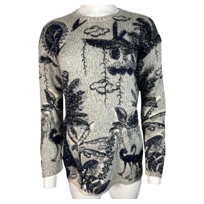 Christian Dior embroidered cashmere sweater in gray size 2: Christian Dior embroidered cashmere sweater in gray size 2 A Christian Dior grey cashmere sweater with an embroidered design. It features a boxy, relaxed shape and detailed flora and fauna motifs. The