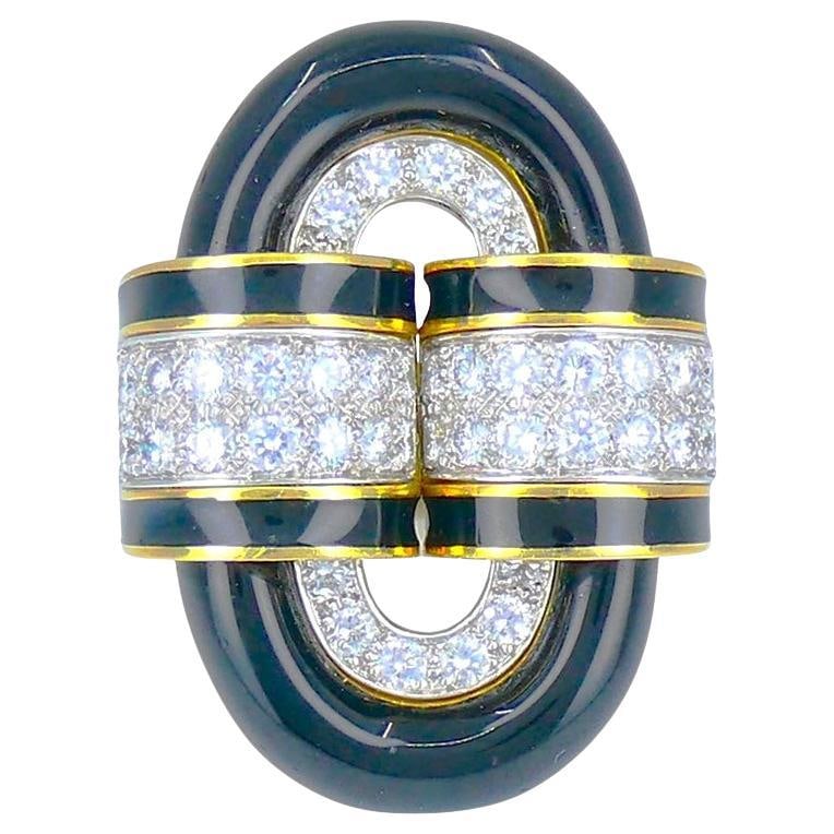 David Webb Buckle Ring 18k Gold Platinum Diamond Black Enamel: David Webb Buckle Ring 18k Gold Platinum Diamond Black Enamel Vintage David Webb buckle ring featuring black enamel and round cut diamonds in an 18k yellow gold and platinum design. The oval center is