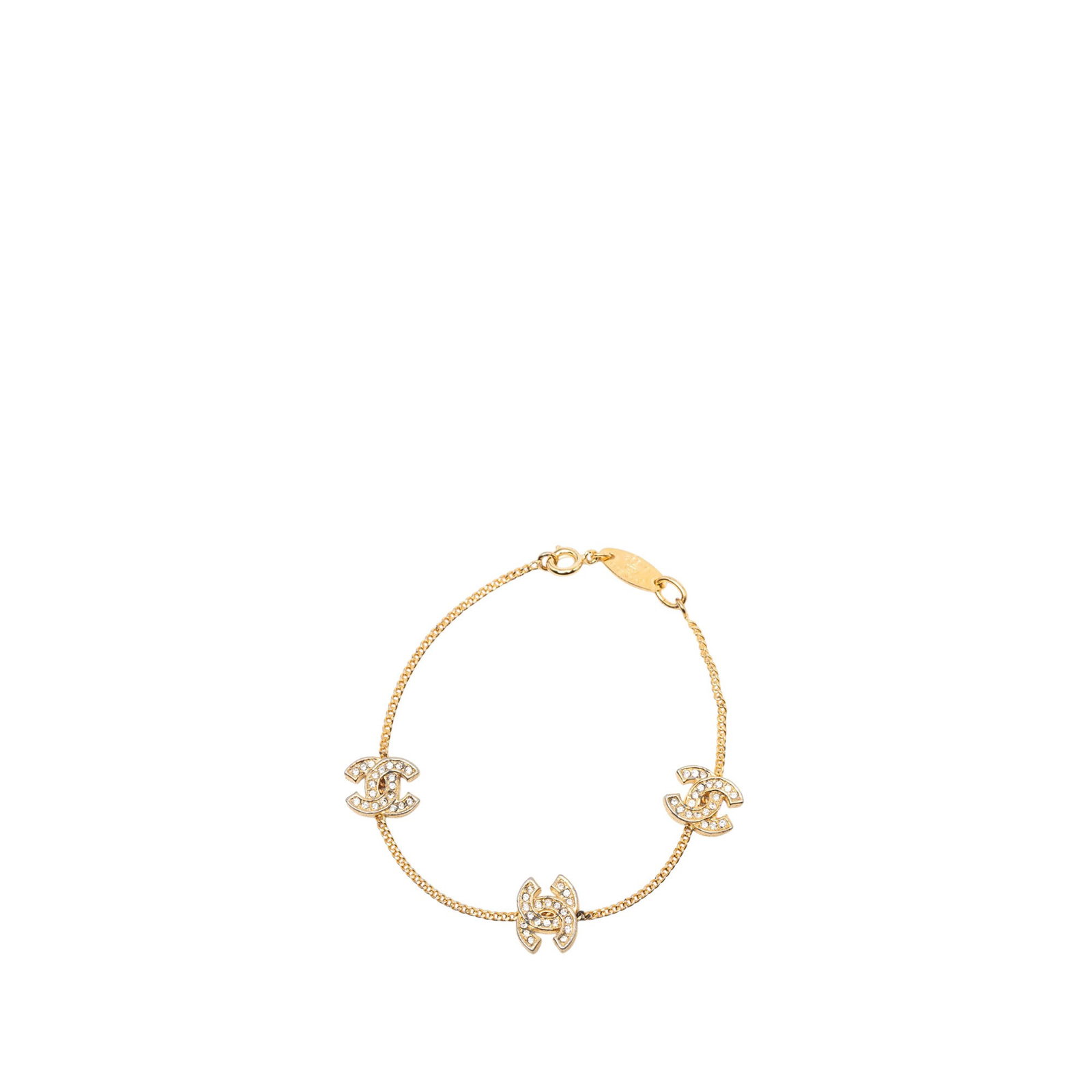 Chanel CC charm bracelet gold plated metal with strass accents: Chanel CC charm bracelet gold plated metal with strass accents Chanel CC charm bracelet with a gold-plated metal body and rhinestone-embellished charms. This costume jewelry piece is finished with a s