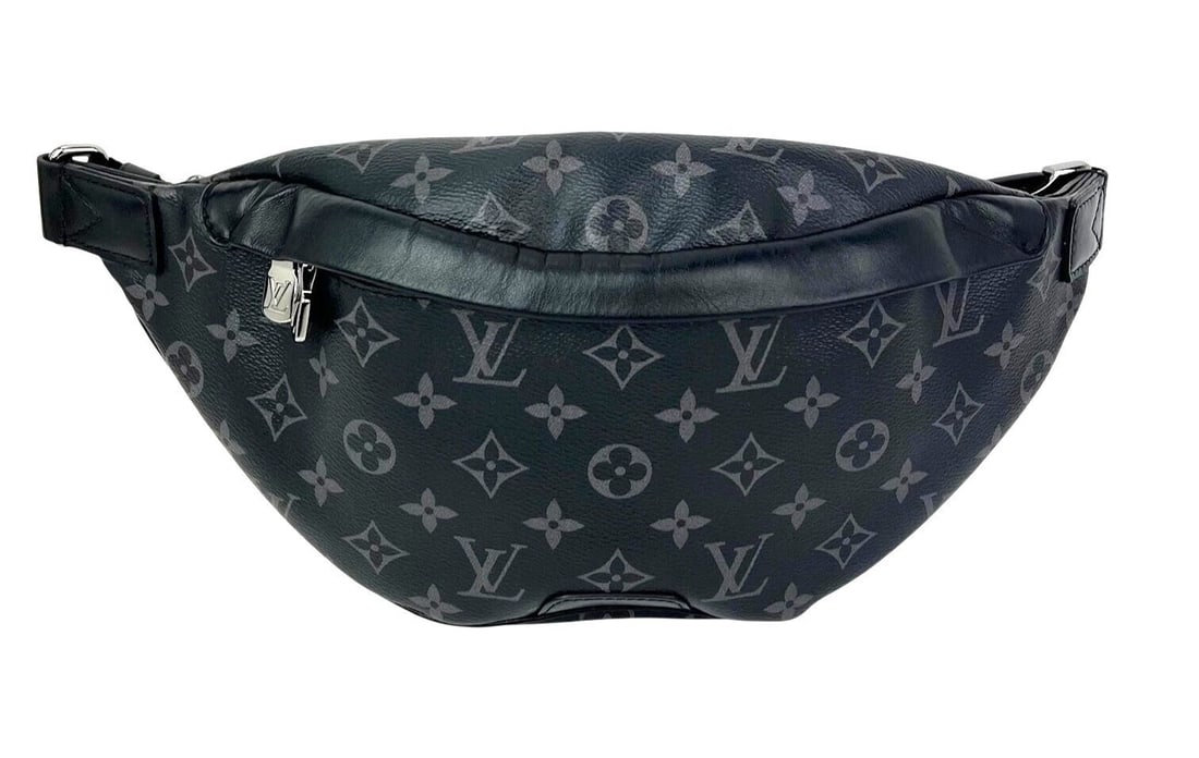 Louis Vuitton Discovery Eclipse Monogram Canvas Sling Bag: Louis Vuitton Discovery Eclipse Monogram Canvas Sling Bag Pre-owned Louis Vuitton Discovery sling bag in Monogram Eclipse coated canvas with a crescent shape and zip closure. This medium bag features 