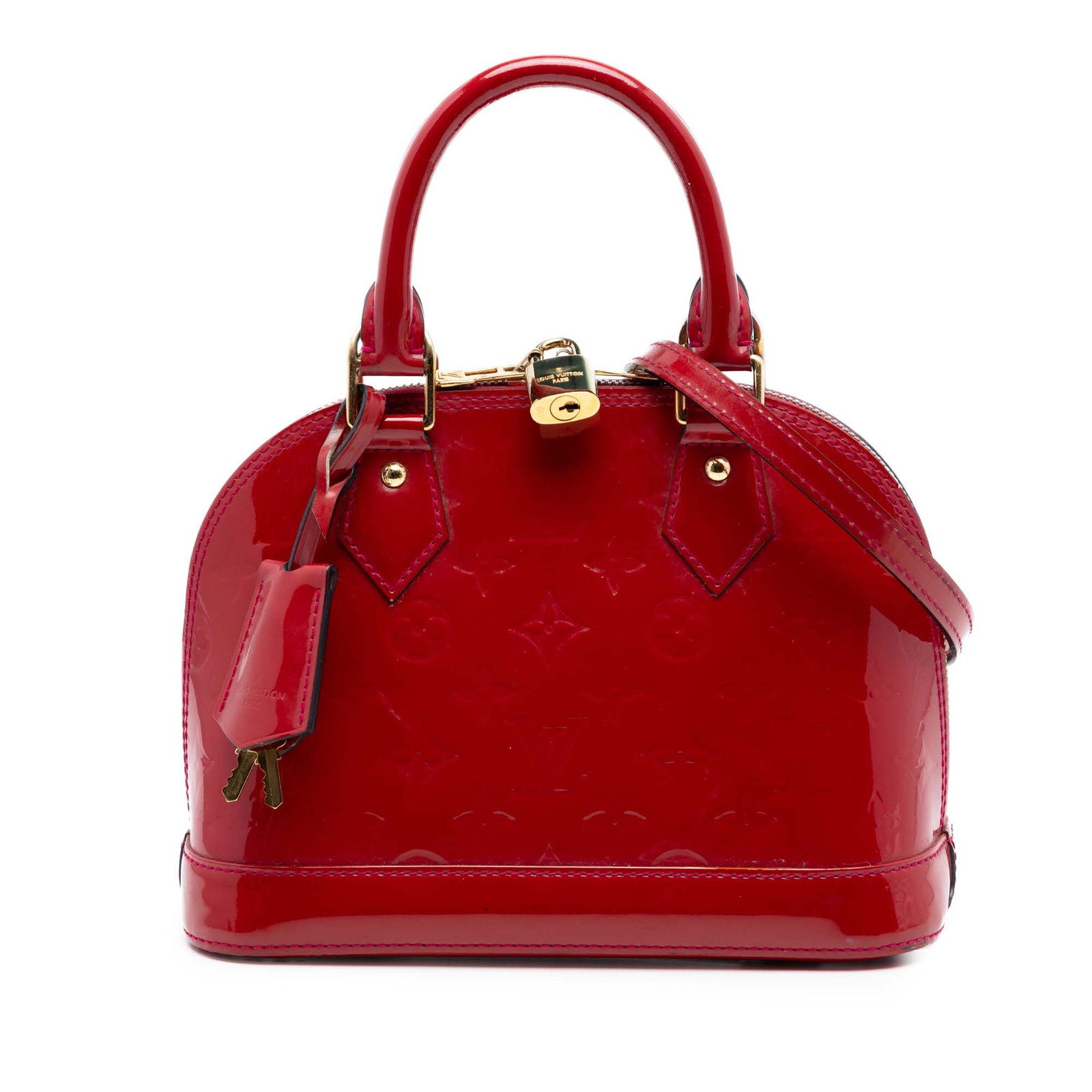Louis Vuitton Alma BB Monogram Vernis red leather handbag: Louis Vuitton Alma BB Monogram Vernis red leather handbag Louis Vuitton Monogram Vernis Alma BB handbag in red vernis leather. This structured bag features rolled leather handles, a detachable leather