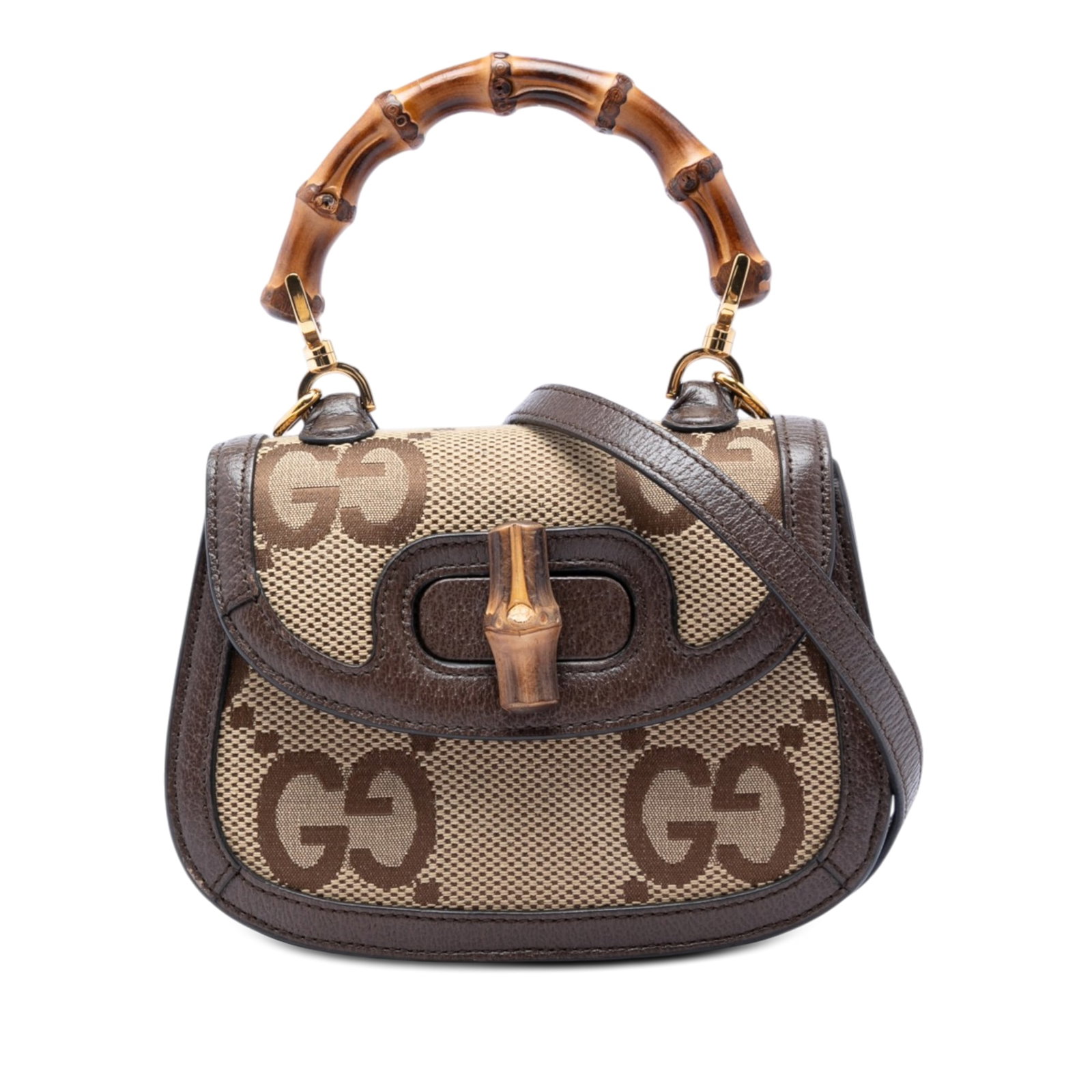 Gucci 1947 Bamboo Top Handle Satchel in Jumbo GG Canvas: Gucci 1947 Bamboo Top Handle Satchel in Jumbo GG Canvas This Gucci Mini Jumbo GG Canvas 1947 Bamboo Top Handle Bag is a satchel in beige canvas with leather trim. It features a bamboo top handle, a de