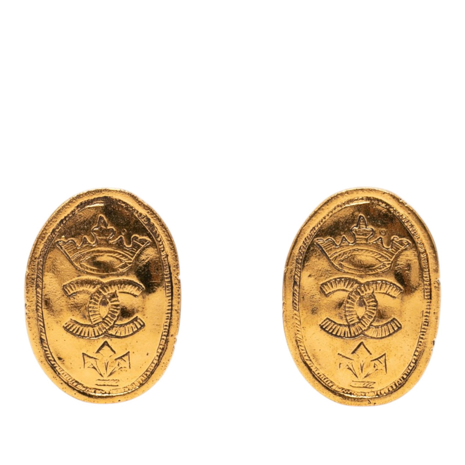 Chanel CC Oval Crown Clip On Earrings Gold Plated Metal: Chanel CC Oval Crown Clip On Earrings Gold Plated Metal These Chanel earrings feature a gold plated metal body with engraved CC logo and crown details. Designed with a clip-on closure, they are crafte