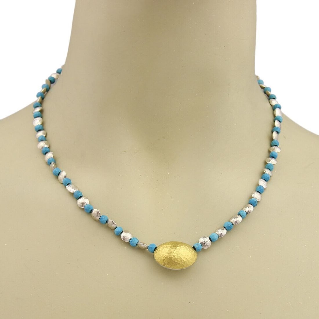 Gurhan Jordan turquoise bead strand necklace sterling silver 24k overlay: Gurhan Jordan turquoise bead strand necklace sterling silver 24k overlay Gurhan Jordan necklace featuring faceted turquoise beads and a sculptural pendant in sterling silver with 24k gold overlay. Thi