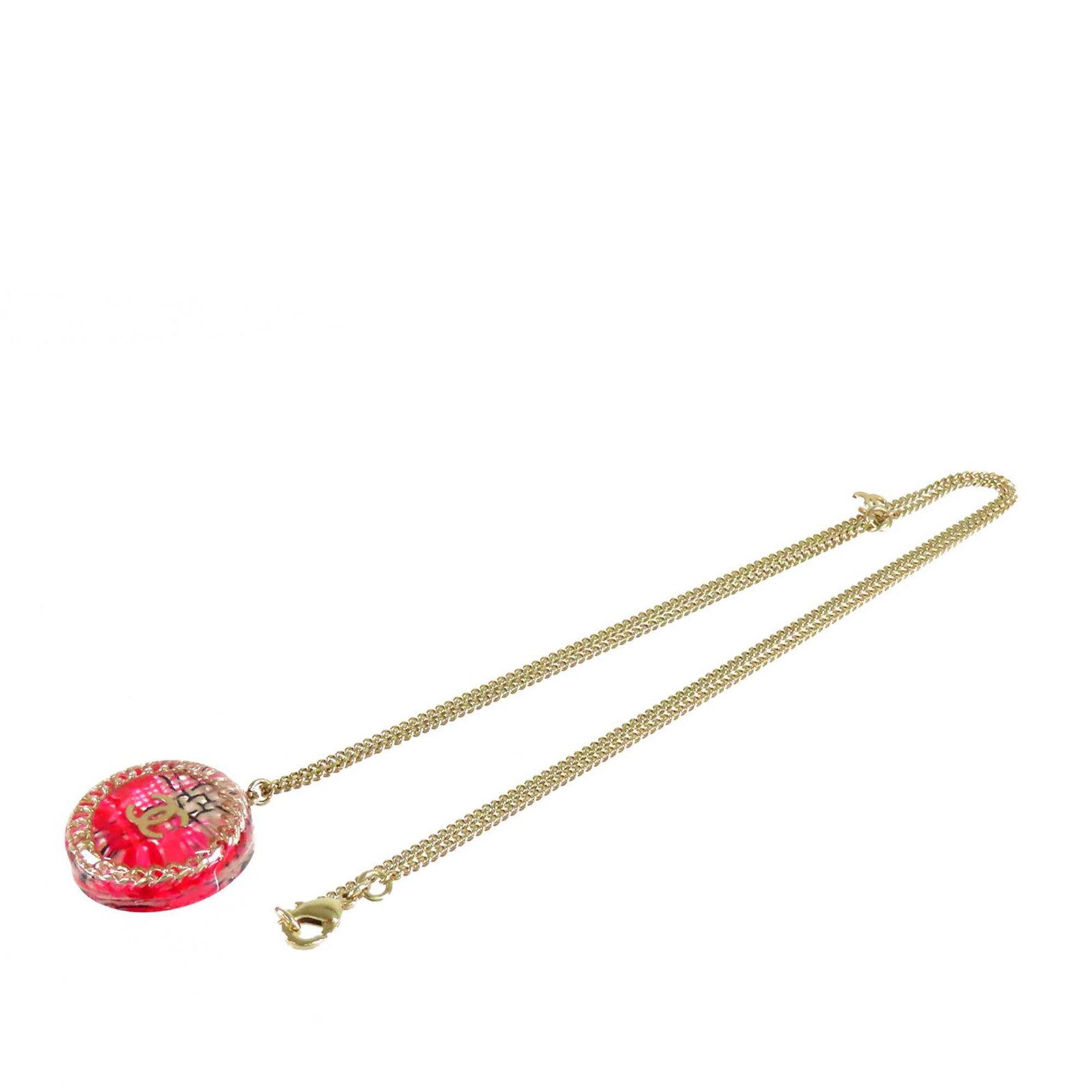 Chanel CC round pendant necklace gold tone resin chain detail: Chanel CC round pendant necklace gold tone resin chain detail Chanel round pendant necklace featuring a gold tone chain and a resin pendant with chain details. Finished with a lobster clasp closure. C