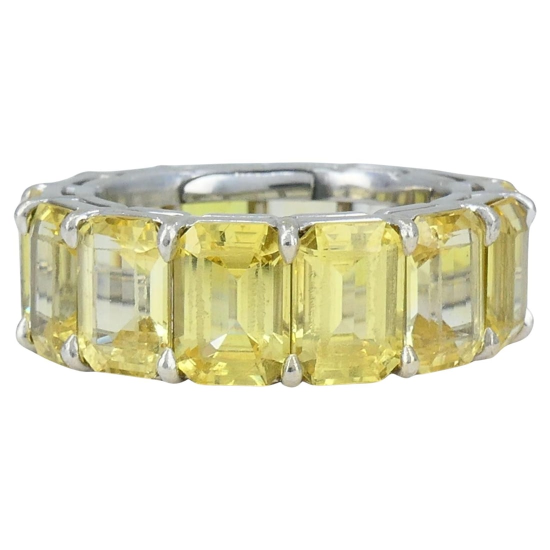 Vintage Bvlgari Platinum Eternity Ring with Yellow Emerald Cut Sapphires: Vintage Bvlgari Platinum Eternity Ring with Yellow Emerald Cut Sapphires Vintage Bvlgari eternity band ring from the 1980s, crafted in platinum and set with a continuous row of emerald-cut yellow sapp
