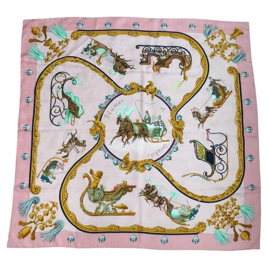 Hermes Plumes et Grelots Pink Silk Scarf by J Abadie: Hermes Plumes et Grelots Pink Silk Scarf by J Abadie Hermes Pink 'Plumes et Grelots' silk scarf by J. Abadie, made in France during the 21st century. The design has a winter festive theme and features