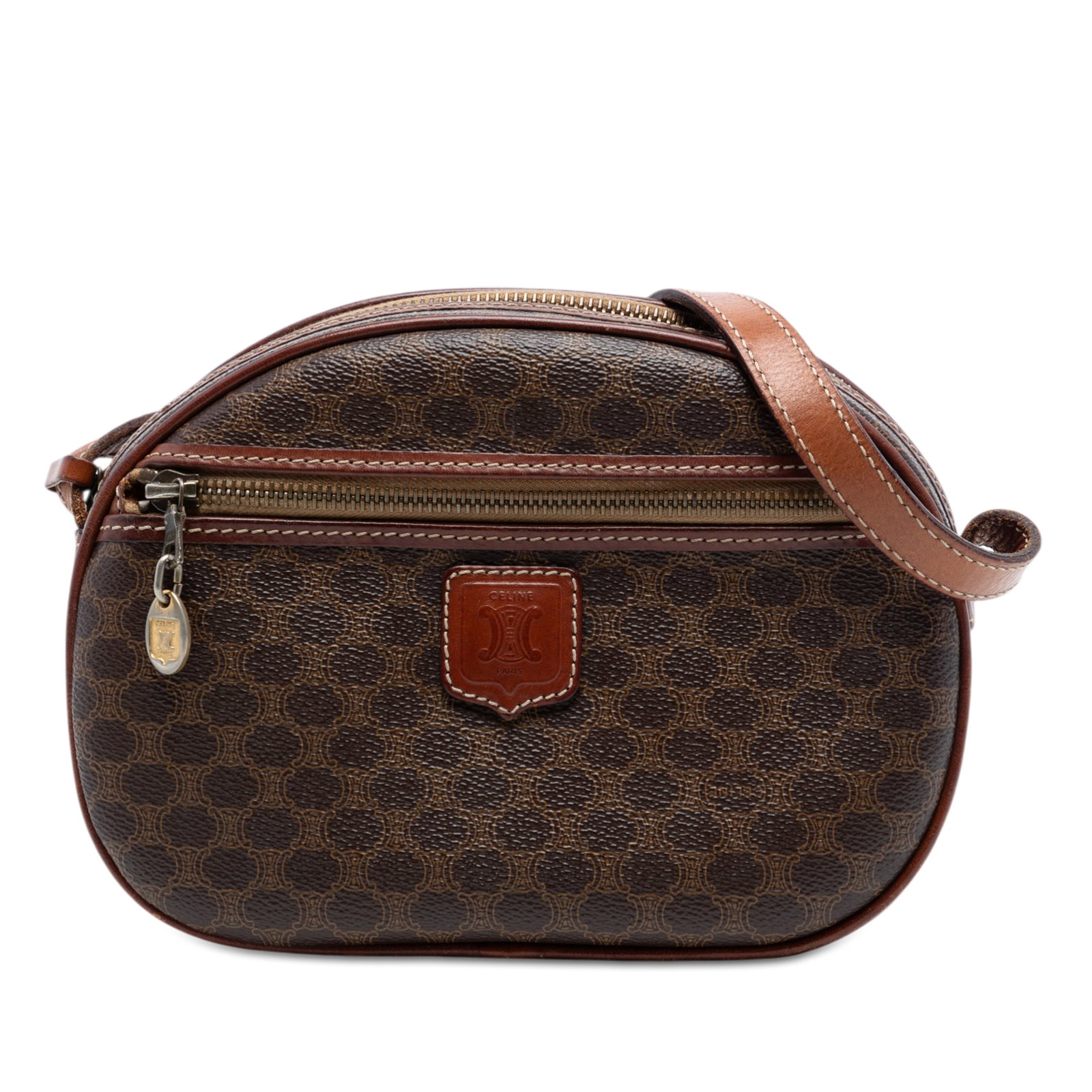 Celine Macadam brown coated canvas crossbody bag: Celine Macadam brown coated canvas crossbody bag This Celine Macadam crossbody bag features a coated canvas body with leather trim, an adjustable flat leather strap, a top zip closure, and an exterior