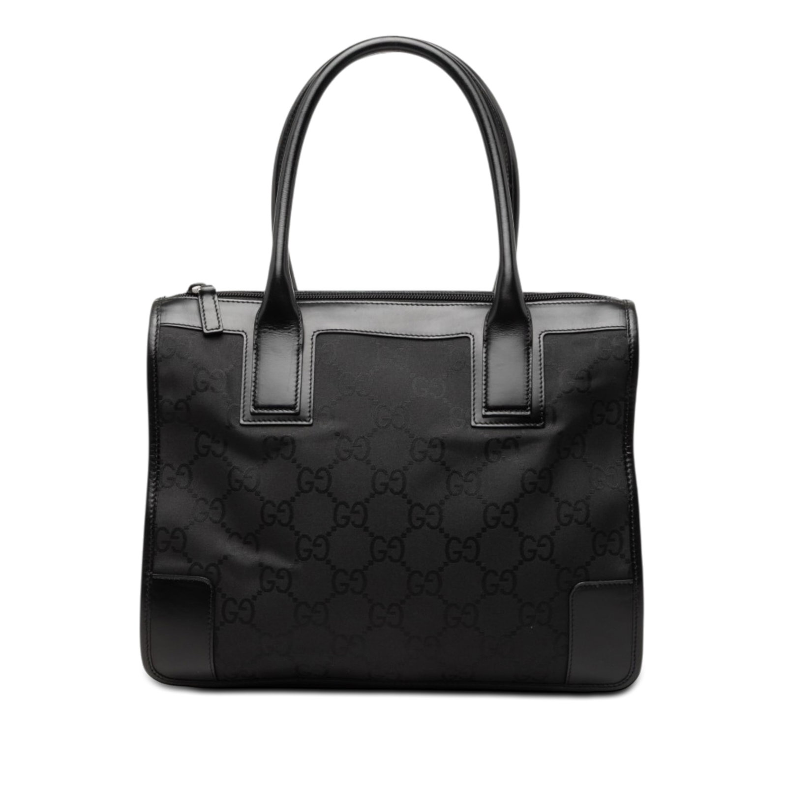Gucci GG Nylon Tote Bag Black Leather Trim: Gucci GG Nylon Tote Bag Black Leather Trim Gucci GG Nylon Tote in black with leather trim and rolled leather handles. This zip-top tote includes an interior zip pocket. Condition is B with visible wea