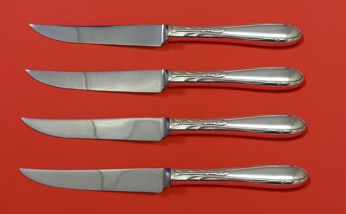 Oneida Heiress Sterling Silver 4 Piece Steak Knife Set 8 1/2": Oneida Heiress Sterling Silver 4 Piece Steak Knife Set 8 1/2" Enhance your dining experience with this exquisite 4-piece steak knife set from the Heiress pattern by Oneida. Crafted from high-quality s