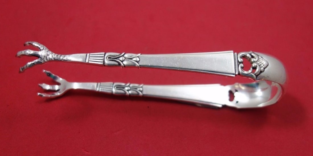 Frigast Danish Crown Sterling Silver Ice Tong 5 1/4 Inches: Frigast Danish Crown Sterling Silver Ice Tong 5 1/4 Inches Enhance your serving experience with this exquisite Danish Crown ice tong by Frigast. Crafted from high-quality sterling silver, this piece i