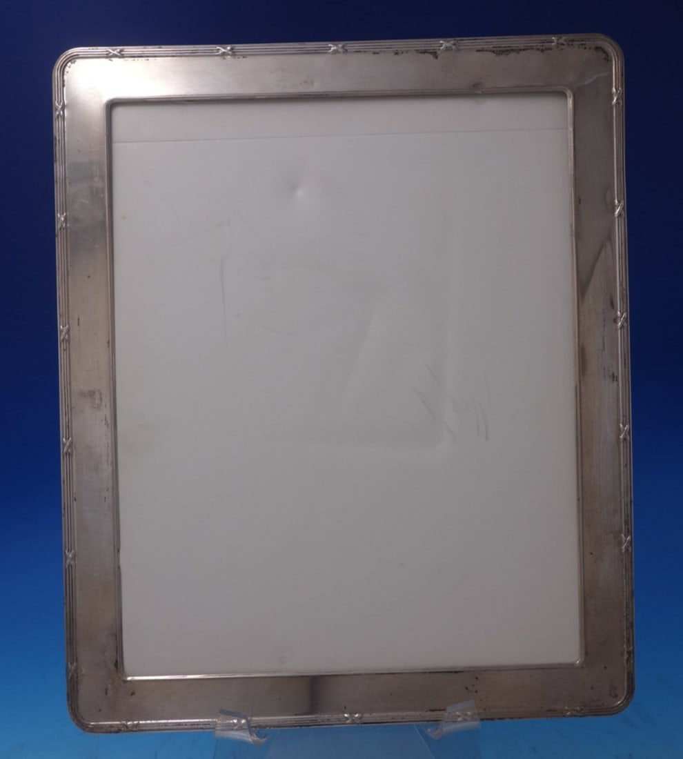 English sterling silver picture frame by Kitney Co 10" x 7 3/4": English sterling silver picture frame by Kitney Co 10" x 7 3/4" English sterling silver picture frame by Kitney & Co., made in the United Kingdom. The frame measures 10" x 7 3/4" and is not monogramme