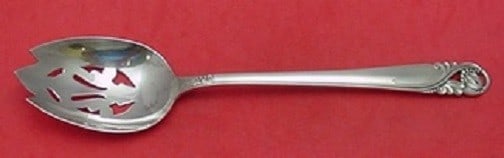 International Silver Spring Glory Sterling Silver Slotted Spoon 8.5": International Silver Spring Glory Sterling Silver Slotted Spoon 8.5" This exquisite serving spoon is a fine example of the Spring Glory pattern by International Silver. Crafted from sterling silver, t