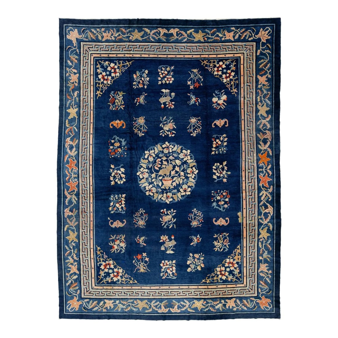 9'10" x 13'2" Chinese Wool Carpet with Blue Ground and Floral Centerpiece: 9'10" x 13'2" Chinese Wool Carpet with Blue Ground and Floral Centerpiece This antique Chinese wool rug is handknotted and features a rich blue field with a central floral medallion. It displays symbo