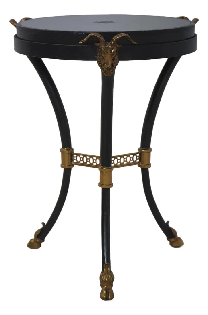 Regency Inspired Round Table with Rams Head Brass Accents and Leather Top: Regency Inspired Round Table with Rams Head Brass Accents and Leather Top This Regency style round occasional table features a quality tooled leather top and an iron base accented with brass ram's hea